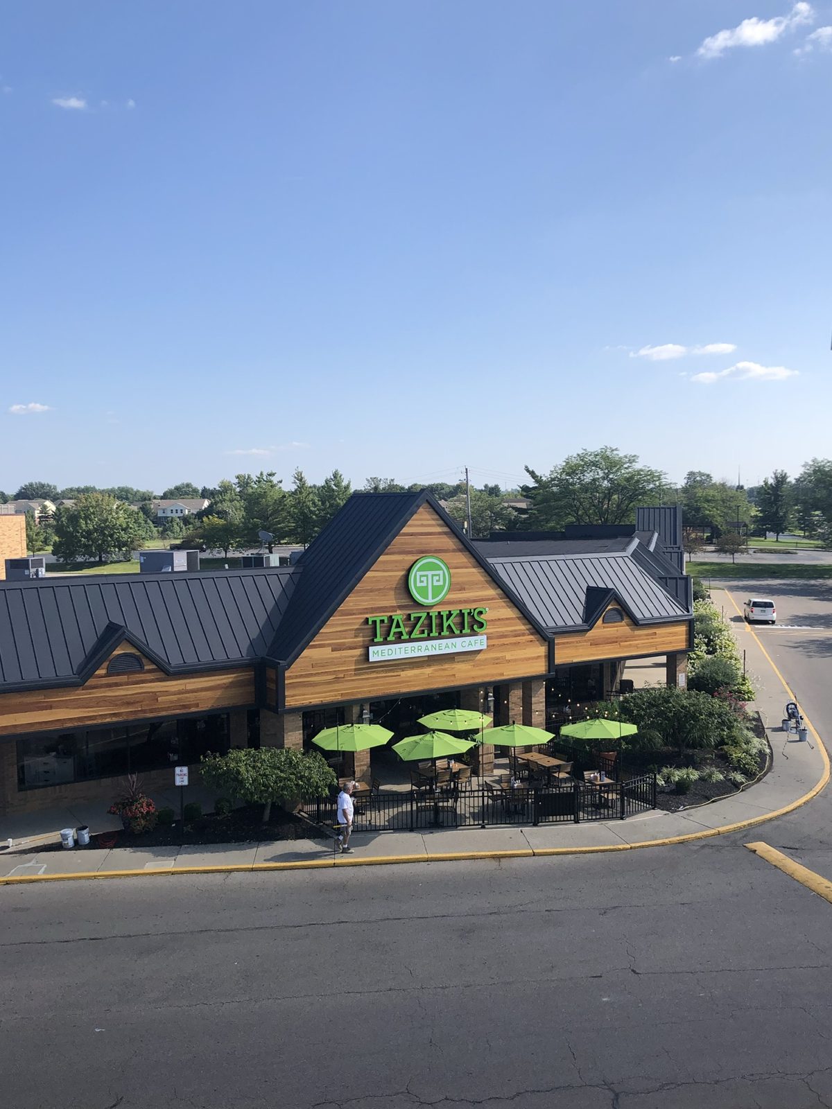 Commercial exterior with stained cedar gables after painting and staining