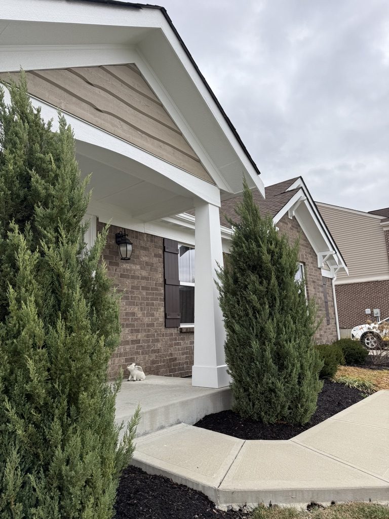 White painted porch columns and trim on a brick ranch in Lebanon, OH