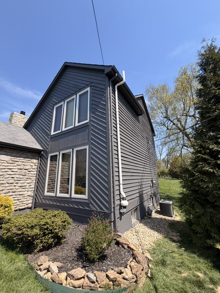 Dark charcoal siding with white window trim on a Mason, OH home