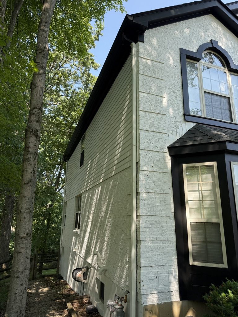 Painted off-white brick home with black trim in Mason, OH