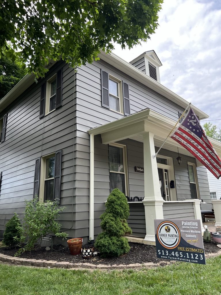 Gray painted aluminum siding with black shutters on a Middletown, OH home after exterior painting
