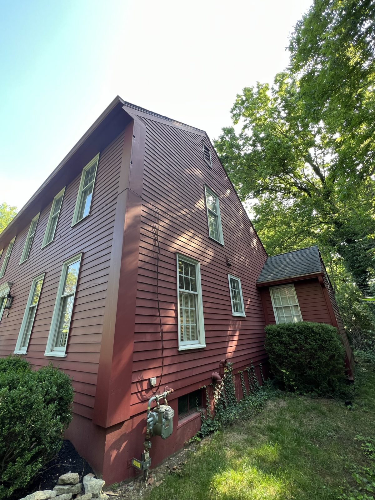 Barn red painted siding with cream window trim on a Middletown, OH colonial