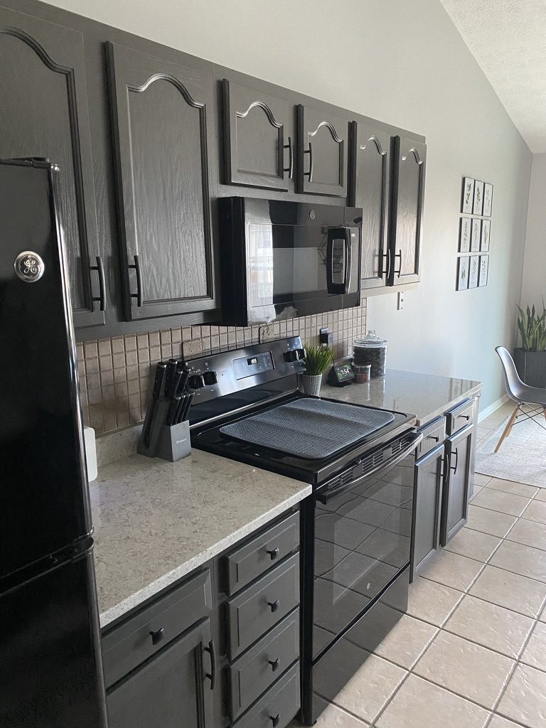 Oak cabinets painted charcoal gray in a Monroe, OH galley kitchen